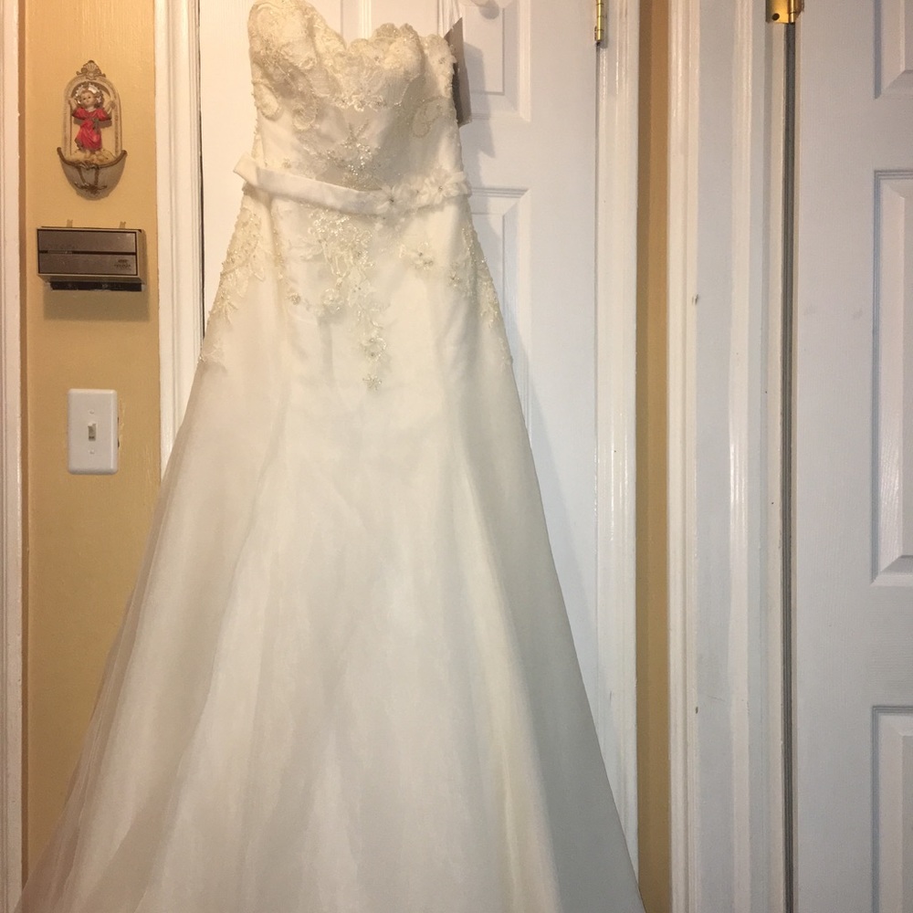 Gorgeous soft white wedding gown. New with tags